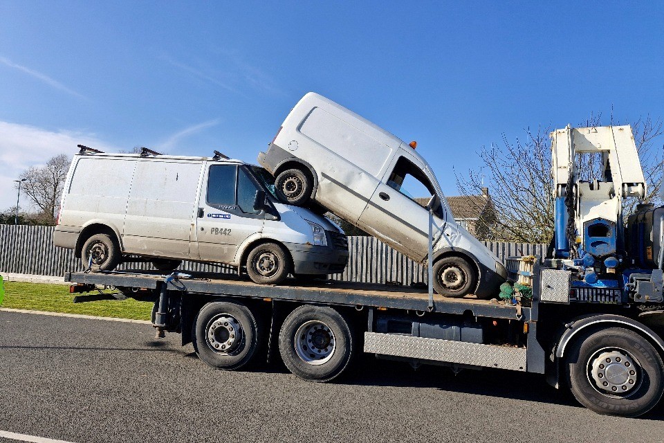 Vehicles suspected of being used in fly-tipping seized and loaded onto a lorry